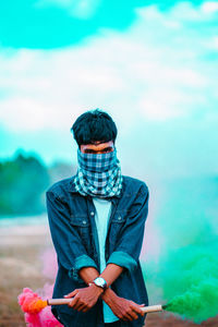 Young man sitting outdoors