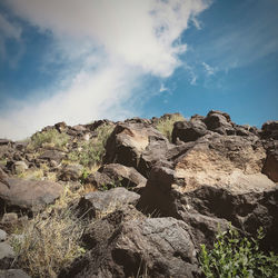 Low angle view of rocks against sky