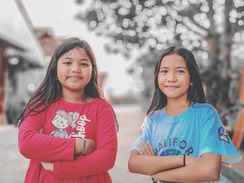 Portrait of smiling girl standing outdoors