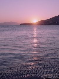 Scenic view of sea against clear sky during sunset