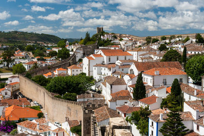 Buildings in town against sky