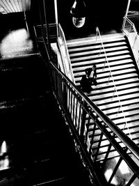 High angle view of people walking on staircase