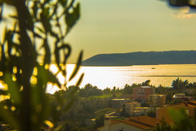 Scenic view of landscape against sky at sunset