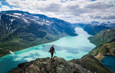 Young woman descending besseggen, jotunheimen, norway.