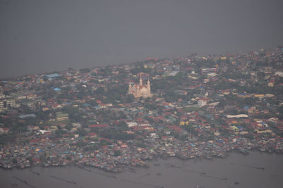 Aerial view of city against sky