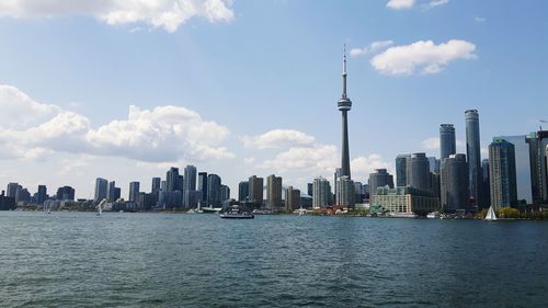 City skyline against cloudy sky