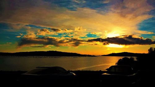 Scenic view of lake against sky during sunset