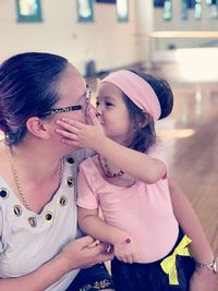 Portrait of happy girl with arms raised