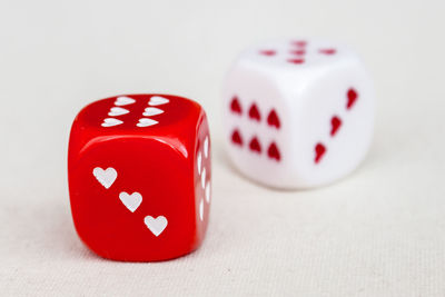 Red and white dices with hearts