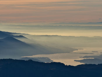 Idyllic view of lake on a foggy autumn evening