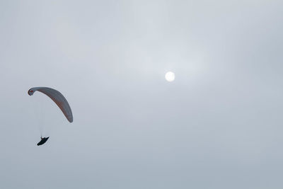 Low angle view of kite flying against sky