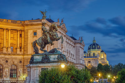 The prinz eugen statue with part of the hofburg and the kunsthistorisches museum in vienna at night