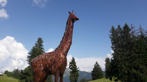 Low angle view of statue against sky
