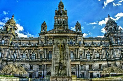 Low angle view of built structure against blue sky