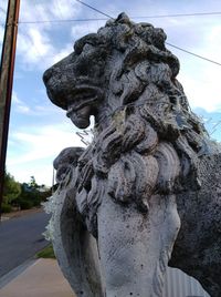 Low angle view of statue against sky