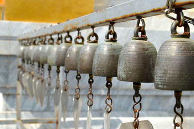 Close-up of bells in row