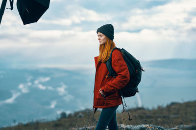 Woman standing against sky