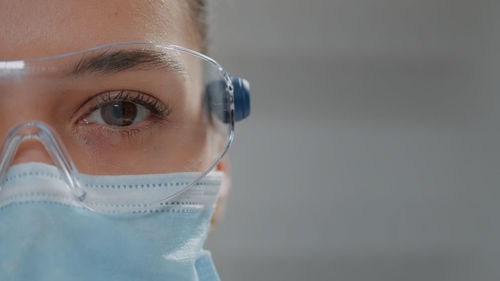 Close-up of man wearing surgical mask