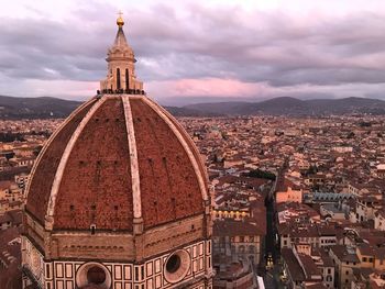 Aerial view of church in town during sunset