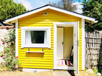 Exterior of yellow house and building