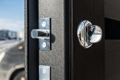 Close-up of padlock on door