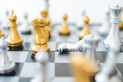 Close-up of chess pieces on table