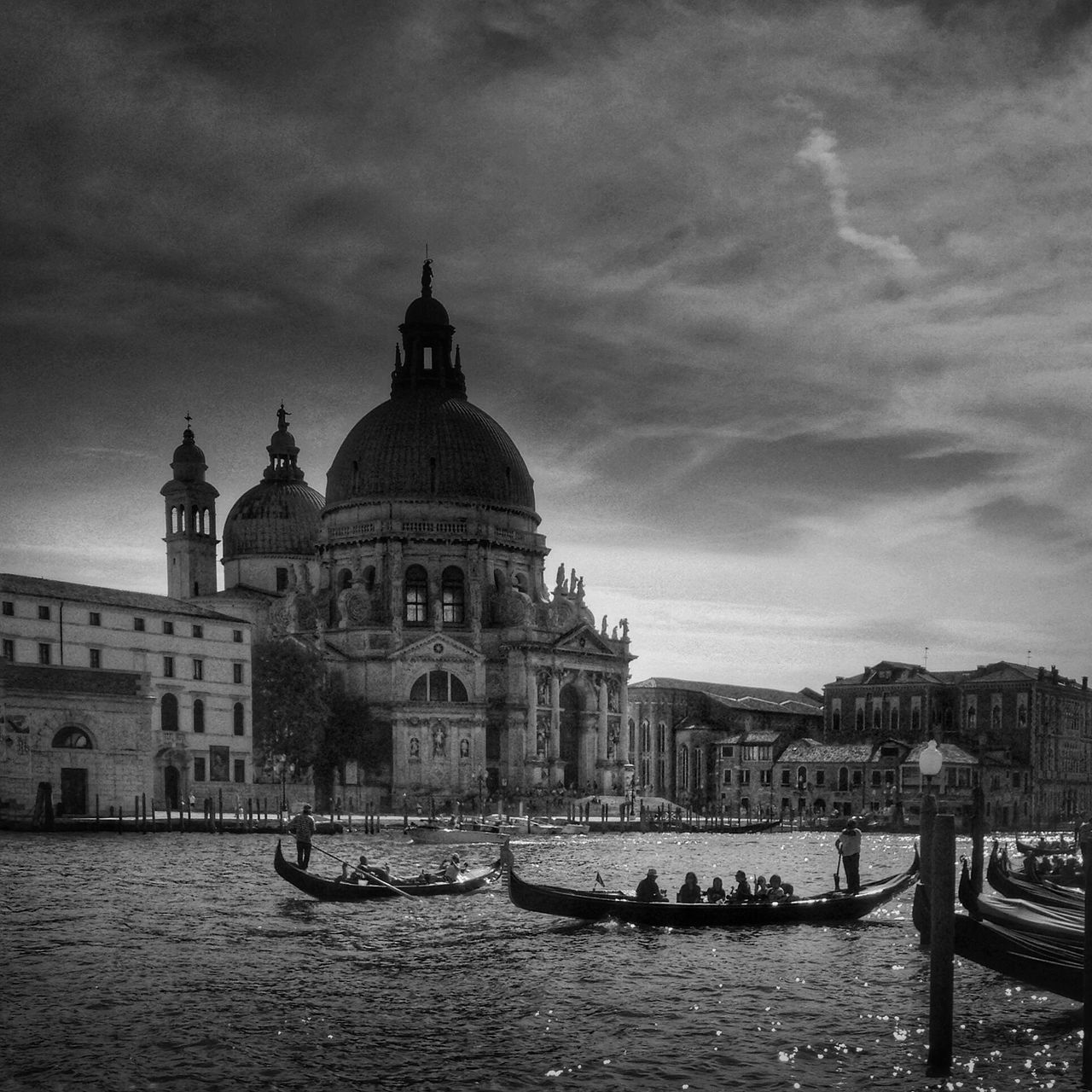 architecture, building exterior, built structure, water, nautical vessel, waterfront, sky, transportation, church, river, mode of transport, religion, dome, place of worship, city, boat, cloud - sky, spirituality