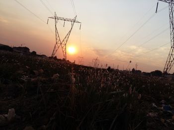 Scenic view of field against sky during sunset