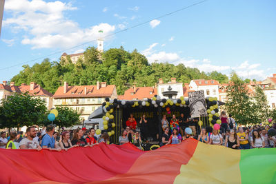 People at town square against sky