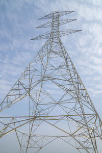 Low angle view of electricity pylon against sky