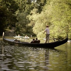 People on boat in river