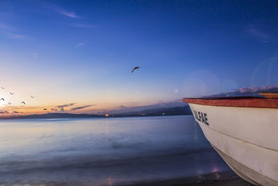 Scenic view of sea against sky at sunset