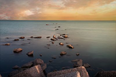 Scenic view of sea against sky during sunset