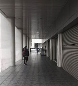 Full length of woman walking in corridor