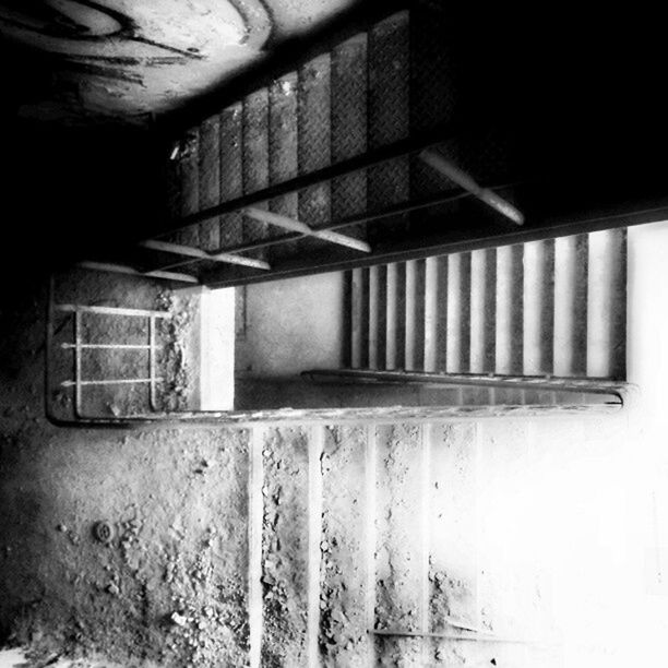 indoors, built structure, architecture, wall - building feature, railing, metal, transportation, no people, steps, staircase, steps and staircases, abandoned, day, wall, sunlight, empty, absence, low angle view, building