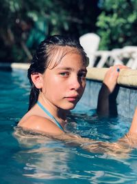 Portrait of woman swimming in pool