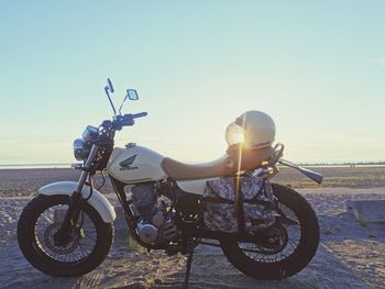 Bicycles against clear sky during sunset