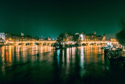 Bridge over river at night