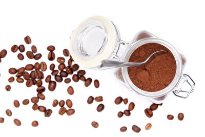 Close-up of coffee beans against white background