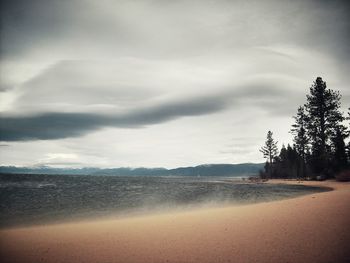 Scenic view of sea against cloudy sky