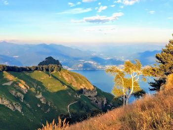 Scenic view of landscape and mountains against sky