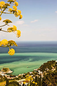 Scenic view of sea against cloudy sky