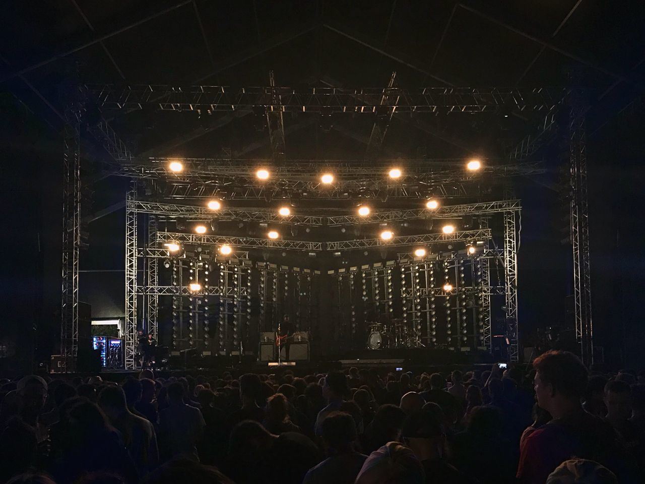 CROWD OF PEOPLE AT ILLUMINATED NIGHTCLUB