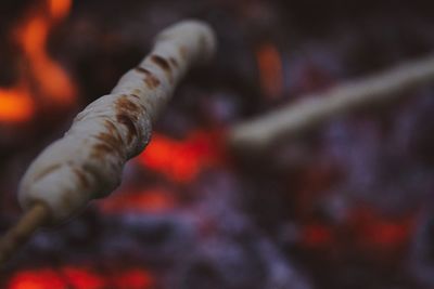 Close-up of cigarette on wood