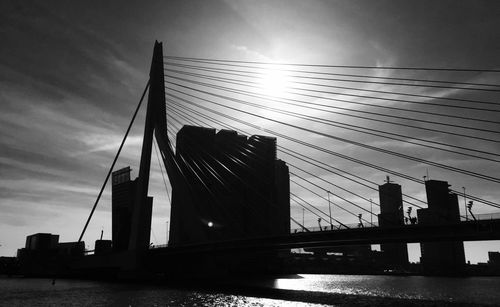 Low angle view of suspension bridge at sunset