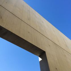Low angle view of built structure against blue sky
