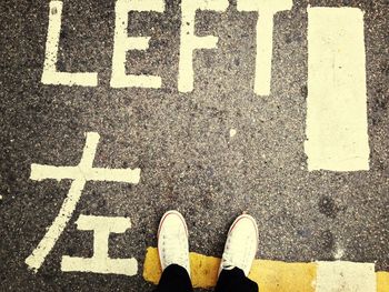 Low section of person standing on street