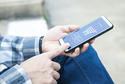 Close-up of man using mobile phone