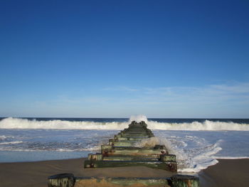 Scenic view of sea against blue sky