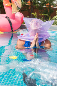 High angle view of girl swimming in pool